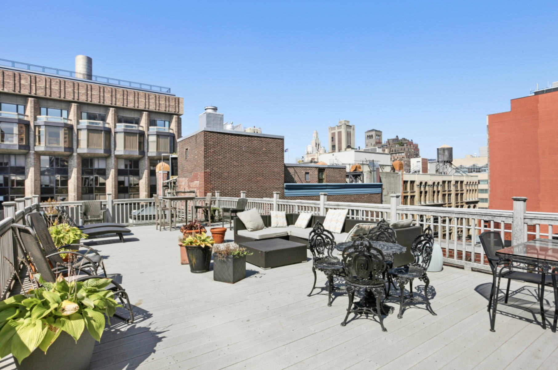 250 Mercer Street, Unit C302 Manhattan, NY 10012 - Photo 15 of 24 a terrace with outdoor seating and city view