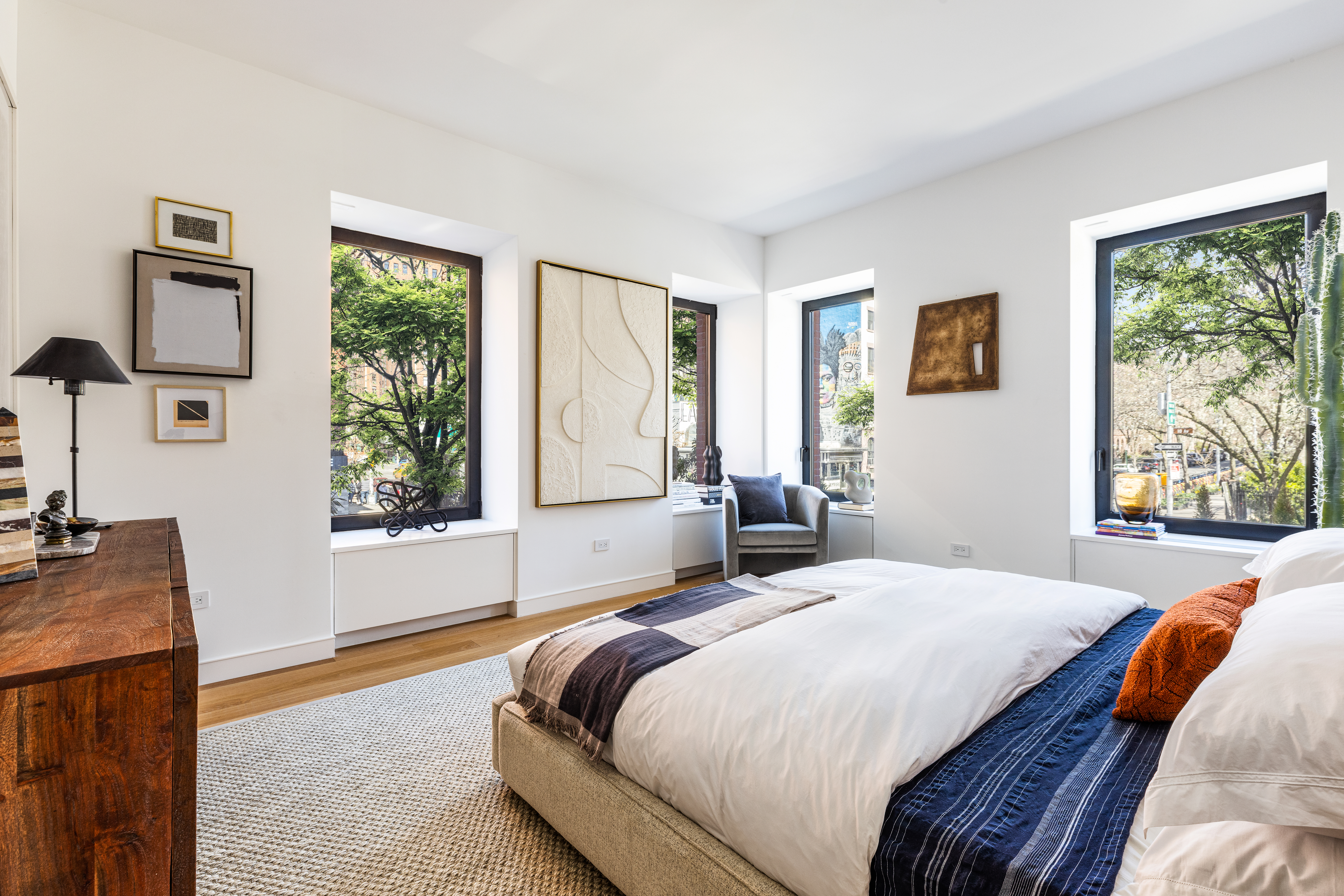 500 West 22nd Street, Unit 2A Manhattan, NY 10011 - Photo 8 of 19 a bedroom with a bed and a dresser next to a window