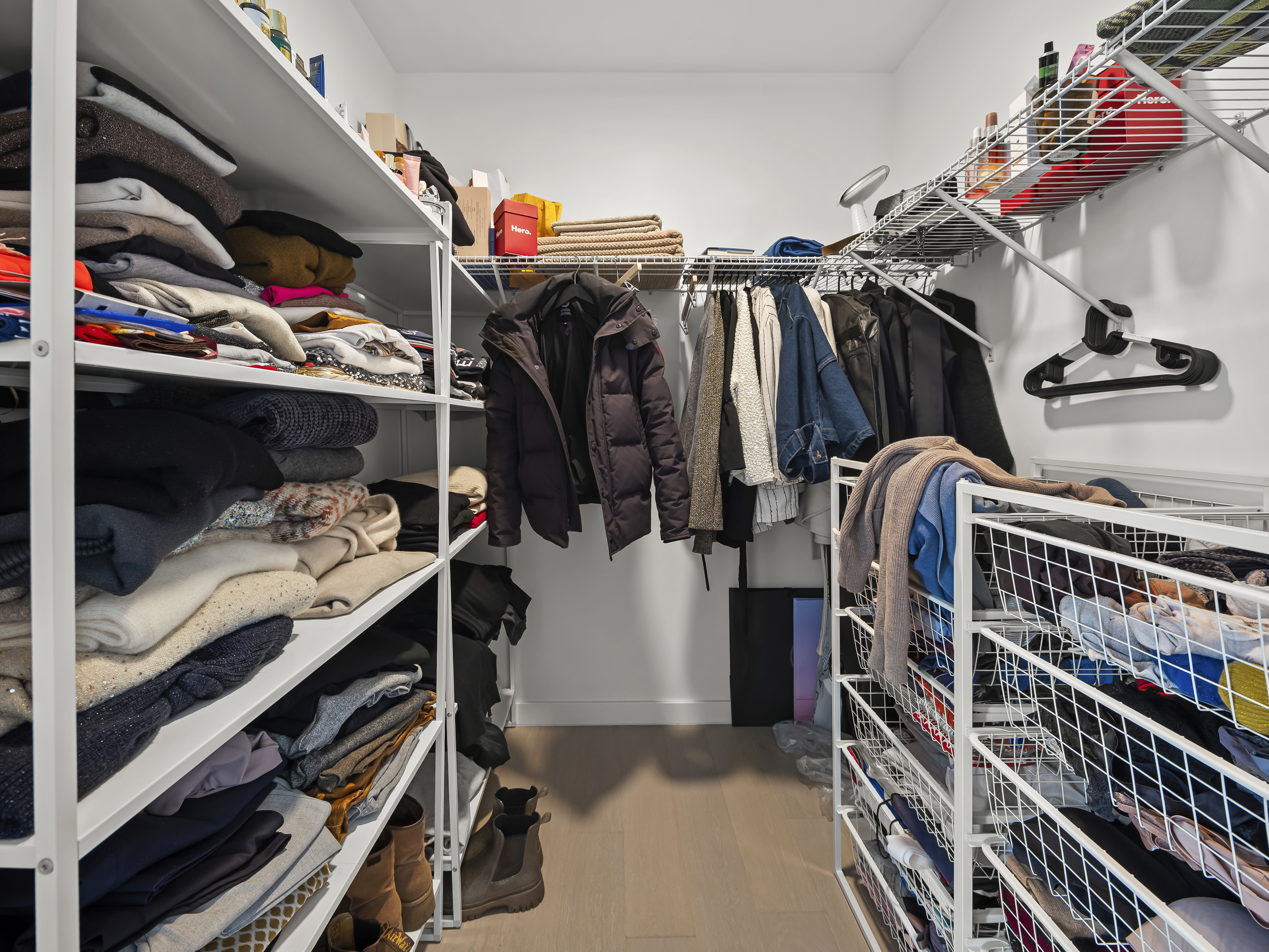 45-3 Court Square, Unit 4406 Queens, NY 11101 - Photo 10 of 22 a view of walk in closet with clothes and shoes