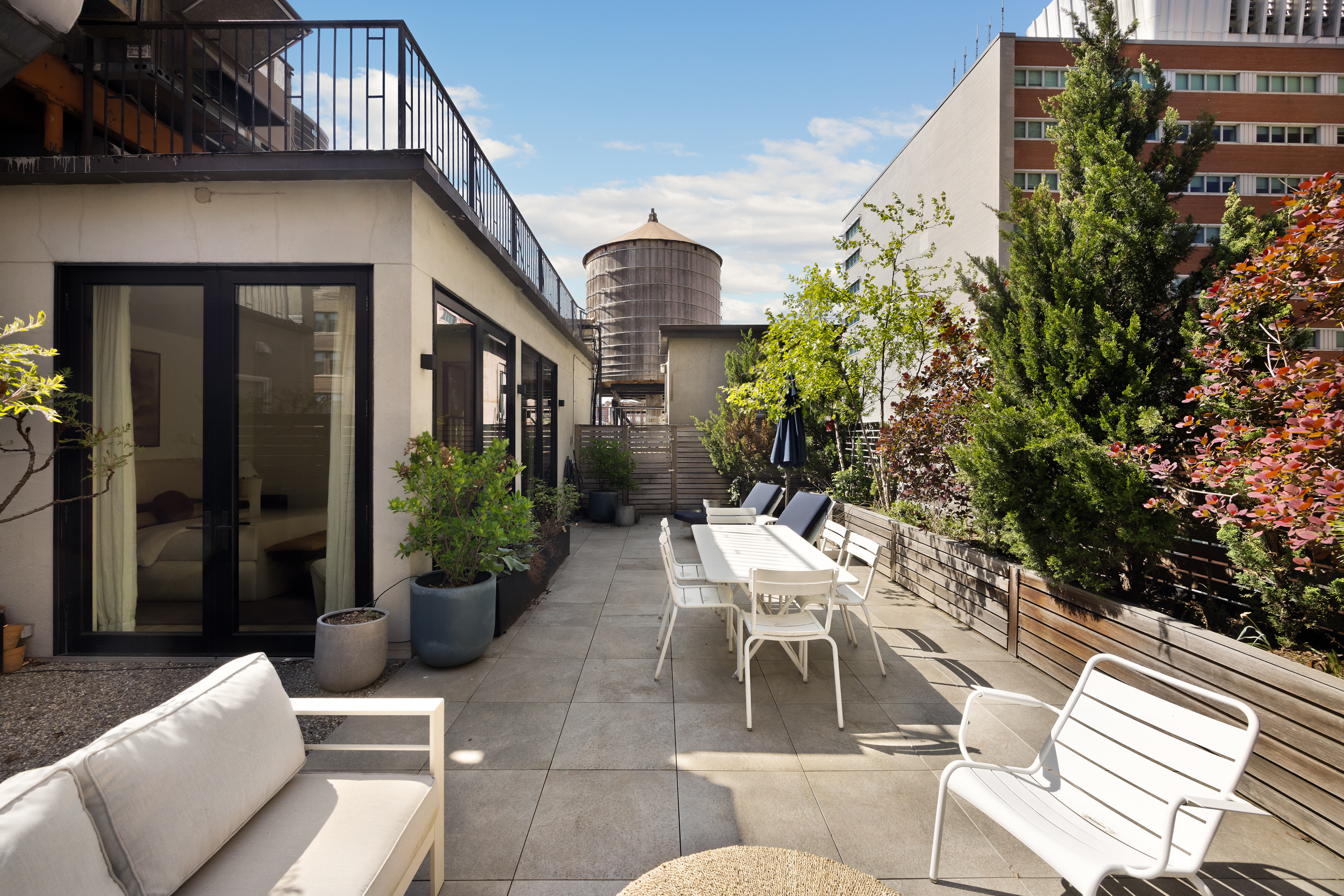 110 Duane Street, Unit PH3S Manhattan, NY 10007 - Photo 11 of 23 a view of a patio with couches table and chairs and potted plants