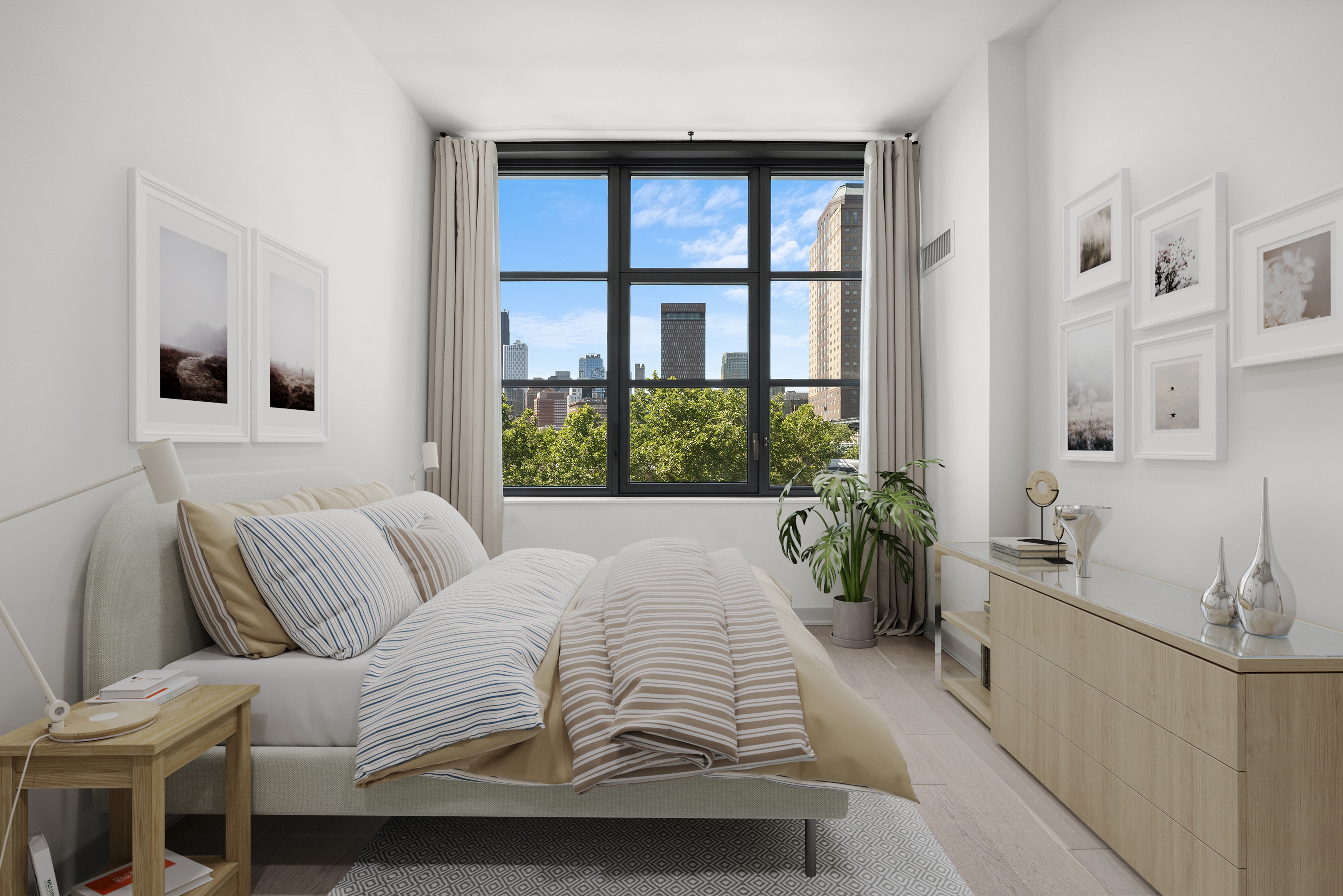 115 York Street, Unit 4J Brooklyn, NY 11201 - Photo 2 of 9 a bedroom with a bed and a large window