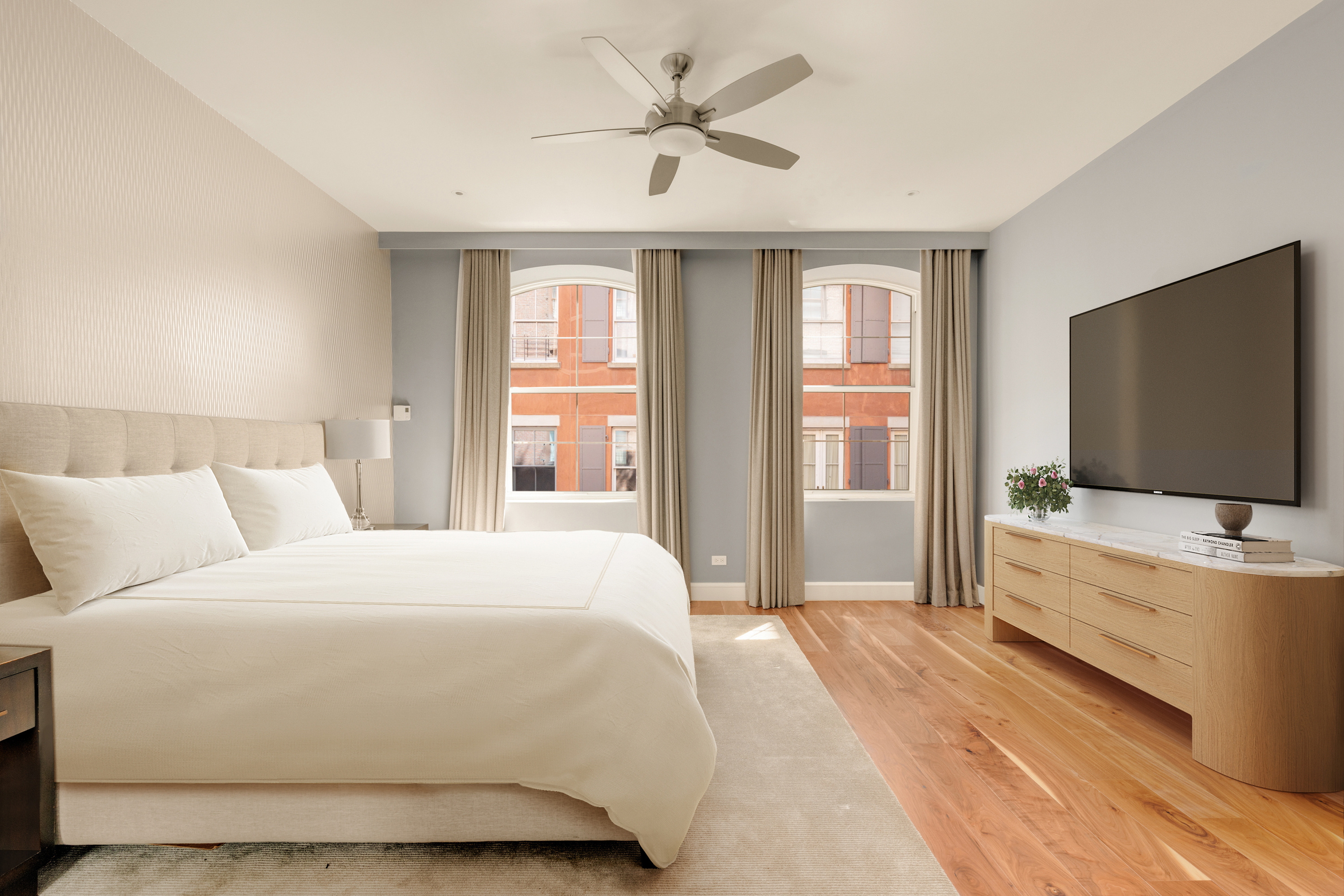 60 Beach Street, Unit 3C Manhattan, NY 10013 - Photo 5 of 12 a bedroom with a bed and a flat screen tv on dresser