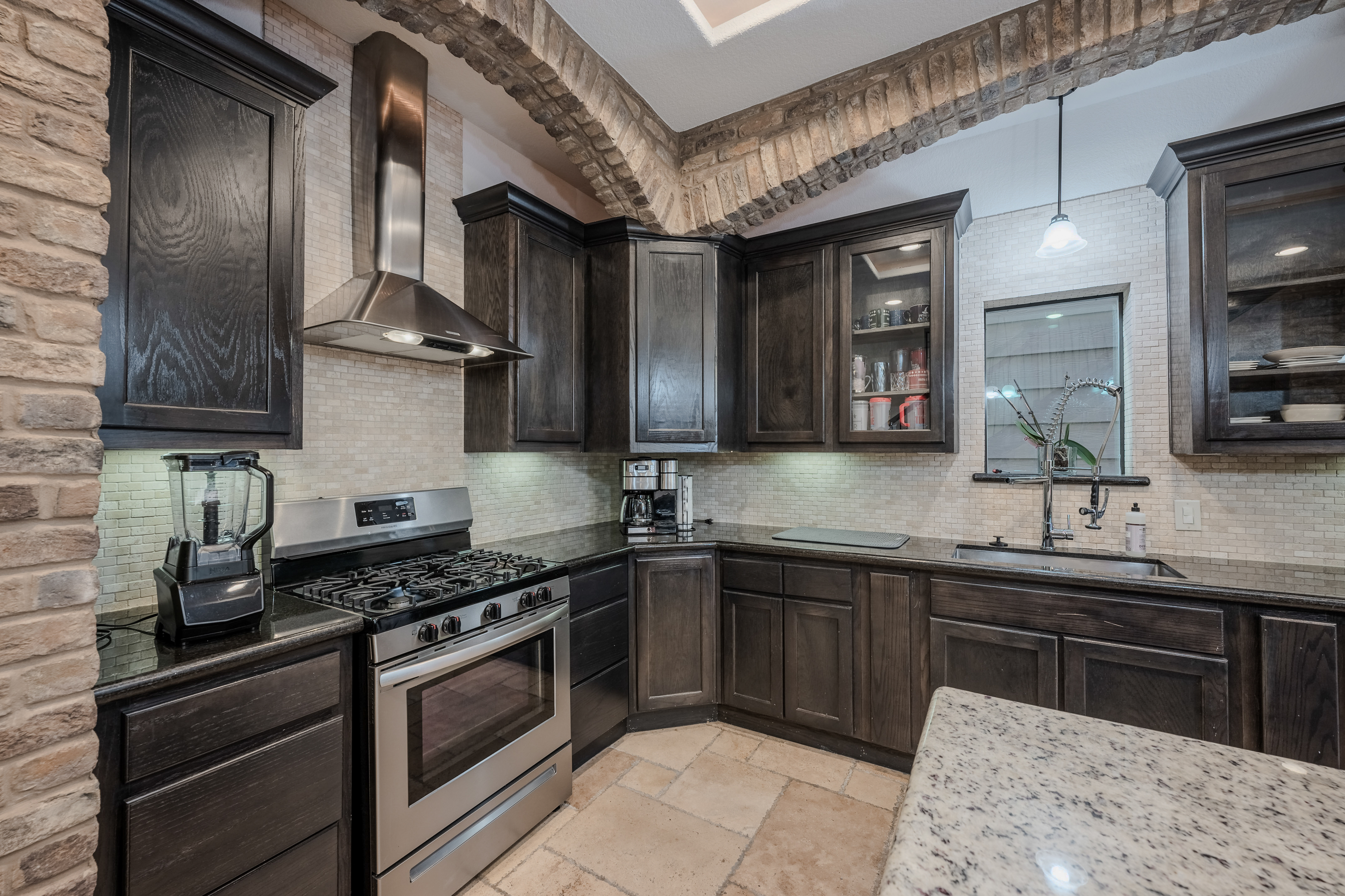 406 Fenn Street Houston, TX 77018 - Photo 7 of 33 a kitchen with stainless steel appliances granite countertop a sink stove and cabinets