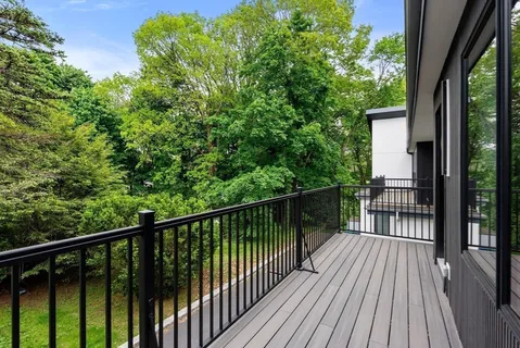 a view of balcony with wooden floor