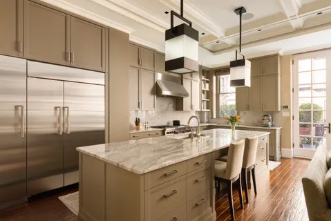 a kitchen with center island and stainless steel appliances