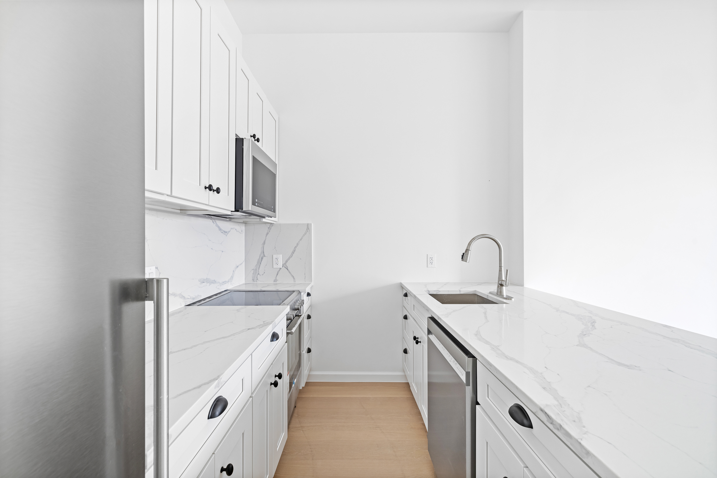 317 Court Street, Unit 3 Brooklyn, NY 11231 - Photo 8 of 15 a kitchen with white cabinets and a sink