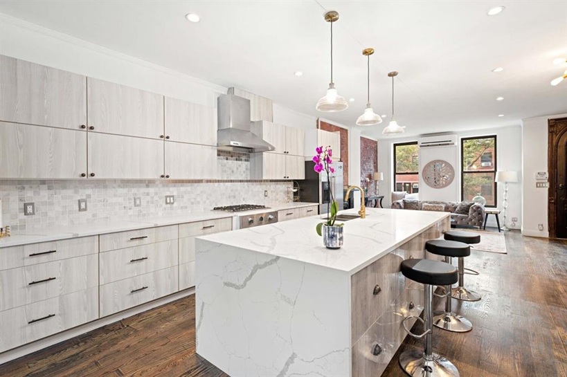 308 Clifton Place Brooklyn, NY 11216 - Photo 3 of 41 a kitchen with sink refrigerator and cabinets