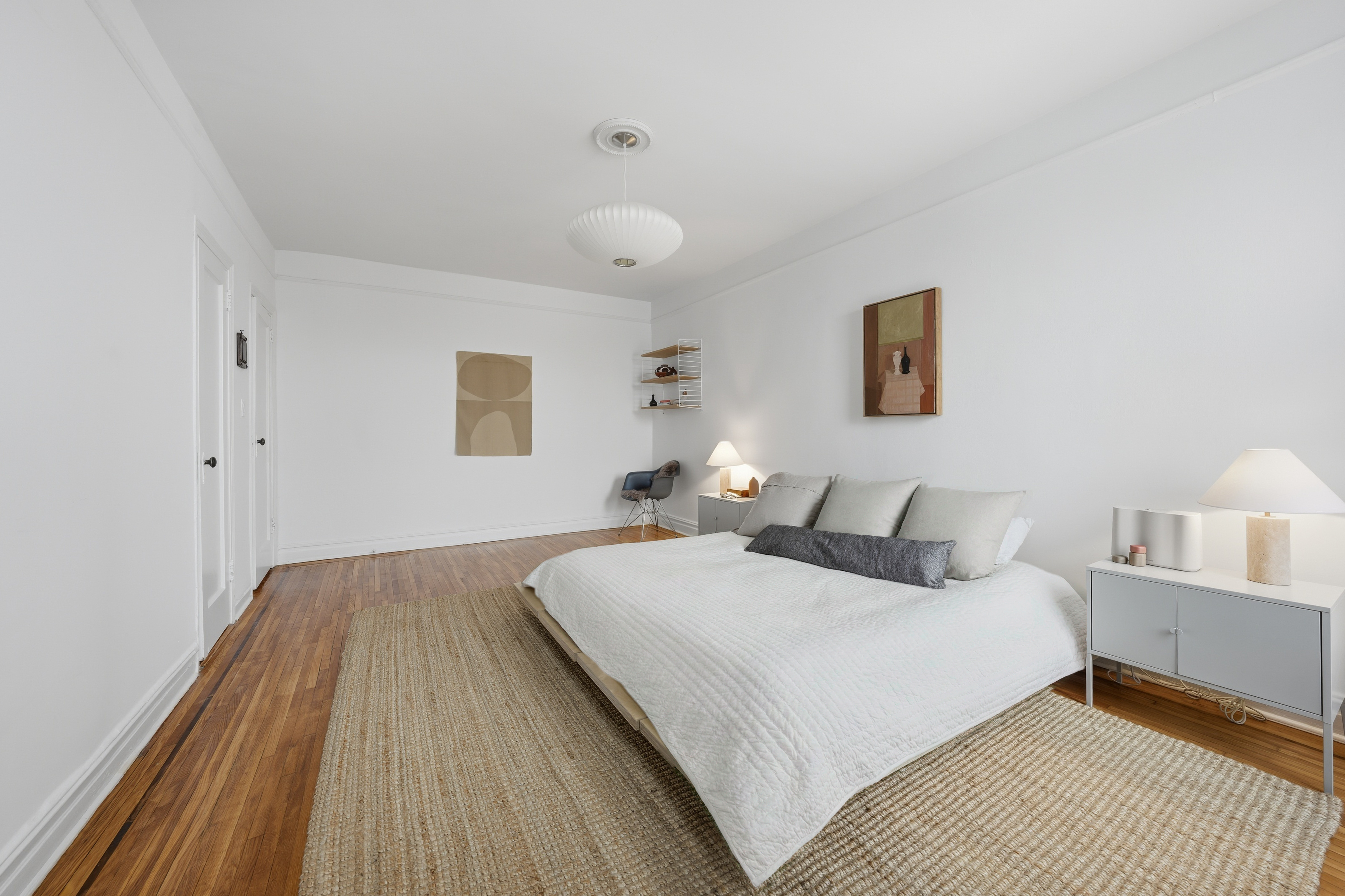 80 Avenue P, Unit D14 Brooklyn, NY 11204 - Photo 15 of 19 a bedroom with a bed and a night stand