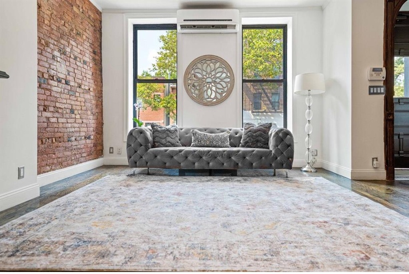 308 Clifton Place Brooklyn, NY 11216 - Photo 9 of 41 a view of a livingroom with furniture and a large window