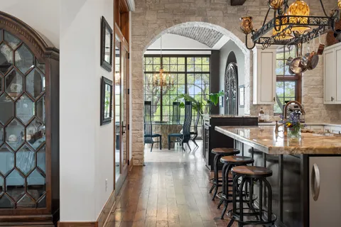 a kitchen with stainless steel appliances granite countertop a stove and a sink