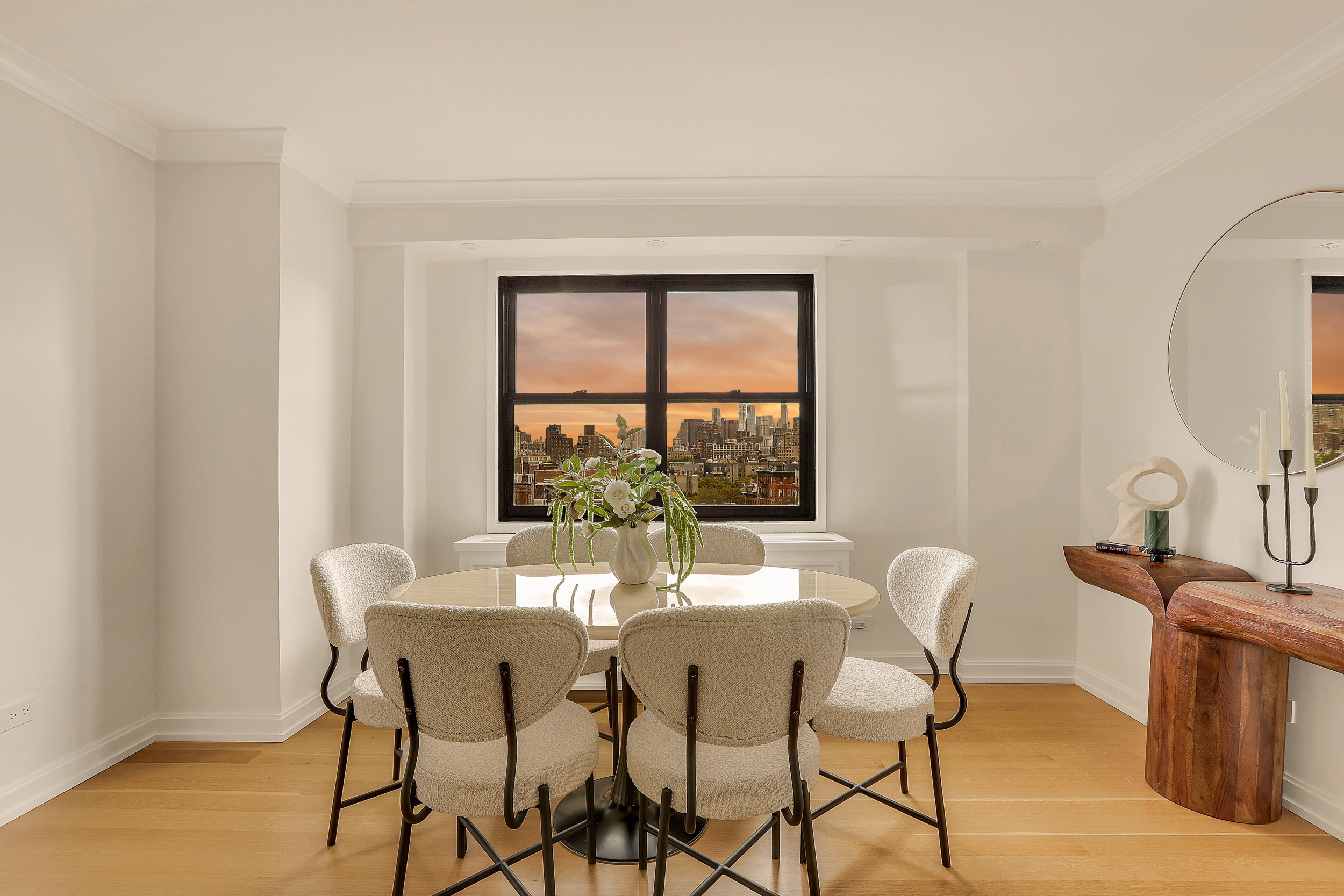 31 Jane Street, Unit 10FG Manhattan, NY 10014 - Photo 8 of 27 a view of a dining room with furniture and a window