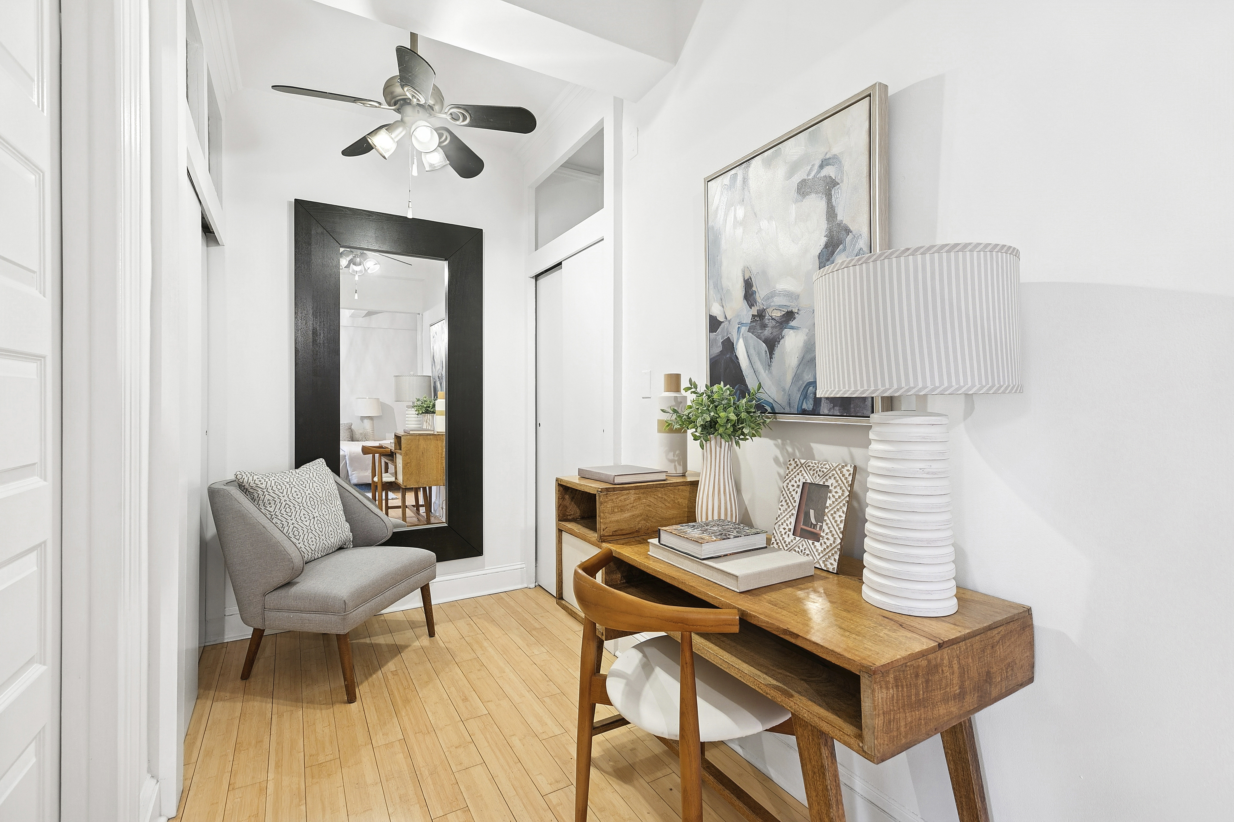 235 East 22nd Street, Unit 4M Manhattan, NY 10010 - Photo 4 of 14 a living room with furniture and a potted plant