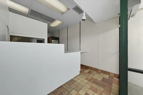 a bathroom with a sink toilet and a mirror