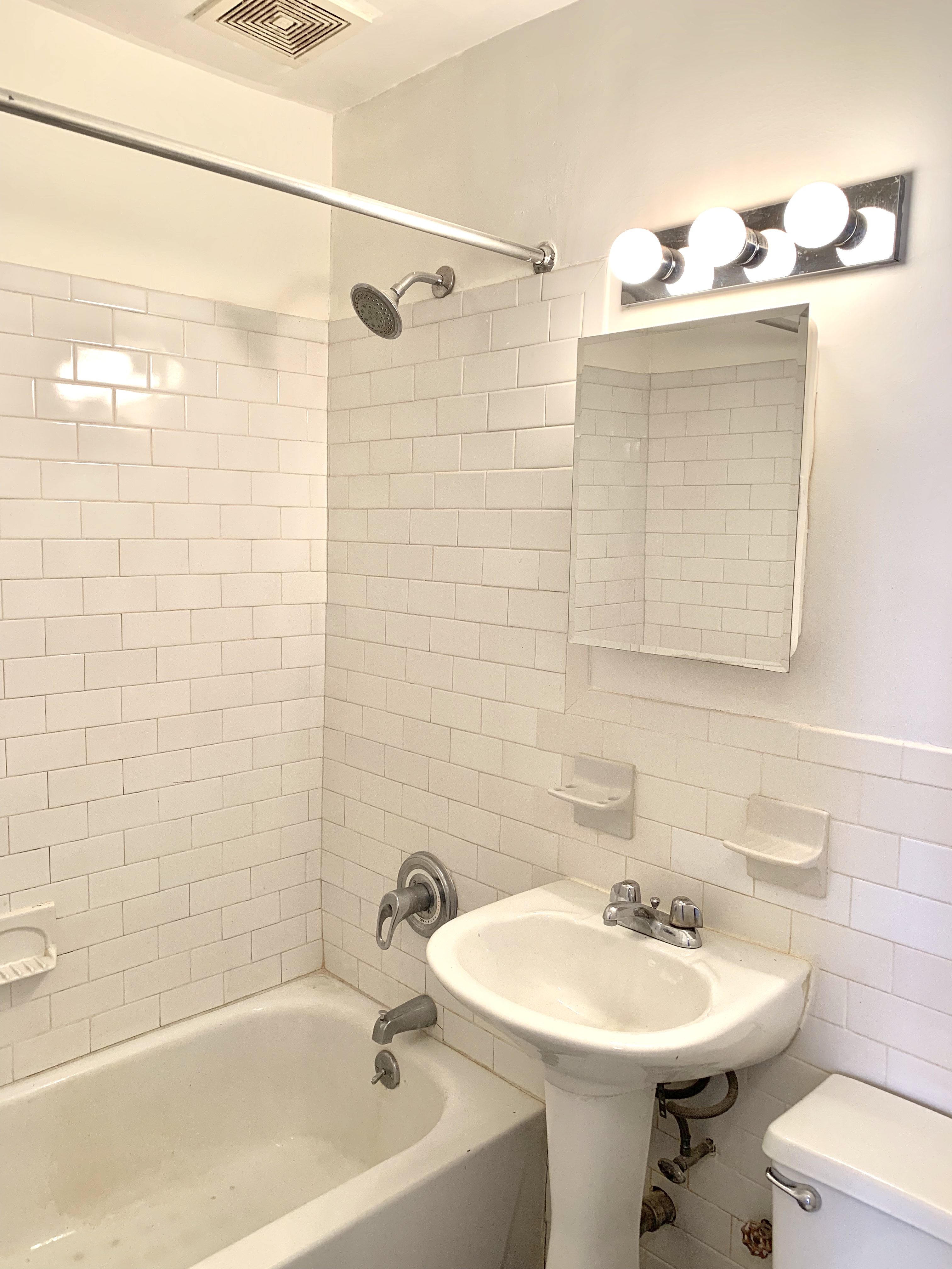 116 West 131st Street, Unit 7 Manhattan, NY 10027 - Photo 5 of 5 a bathroom with a sink a toilet and shower