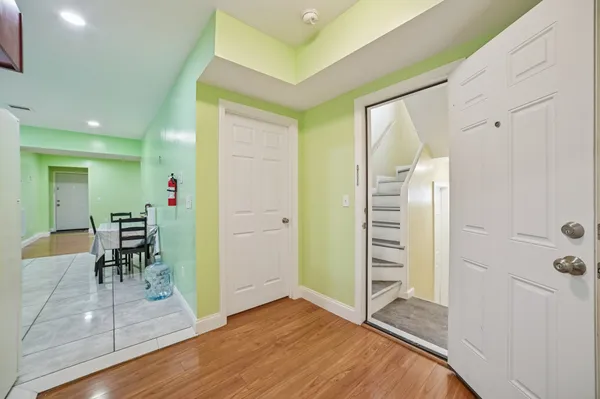 wooden floor in an empty room with a mirror