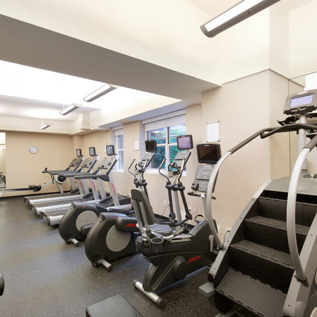 155 West 68th Street, Unit 1907 Manhattan, NY 10023 - Photo 16 of 20 a view of a room with gym equipment