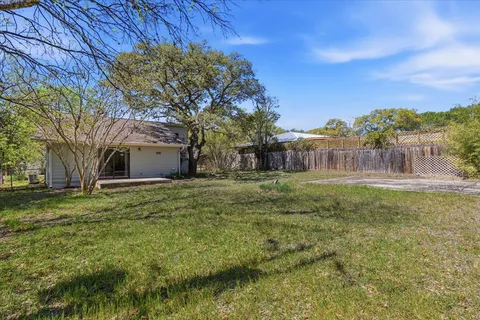 an aerial view of a house with outdoor space pool seating area and yard
