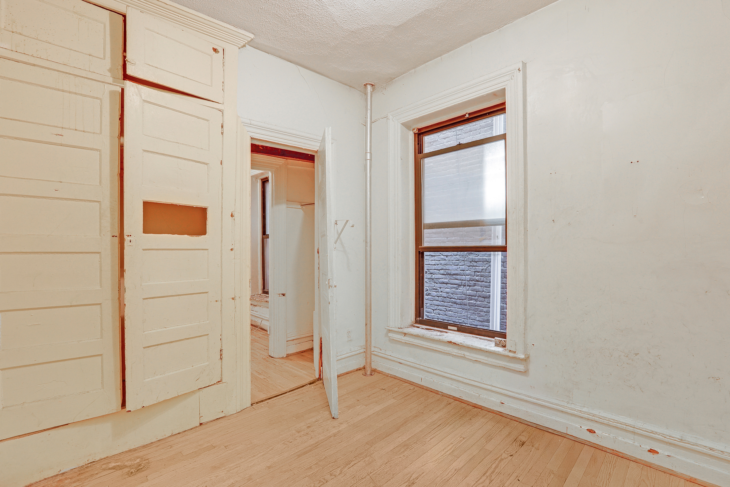 282 Manhattan Avenue, Unit 3N Manhattan, NY 10026 - Photo 13 of 17 a view of an empty room with window