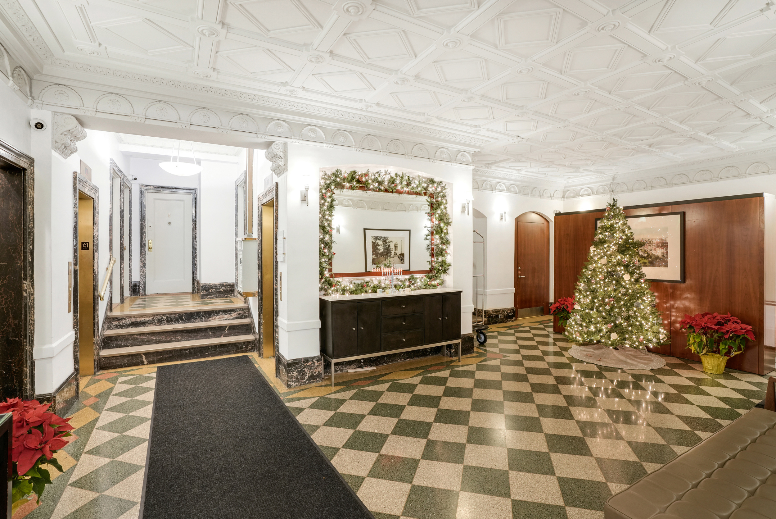315 West 86th Street, Unit 14C Manhattan, NY 10024 - Photo 10 of 13 a view of a hallway with wooden floor and a fireplace
