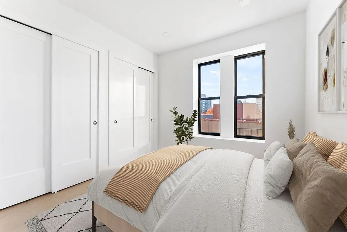 88 5th Avenue, Unit 2B Brooklyn, NY 11217 - Photo 3 of 5 a bedroom with a bed and a window