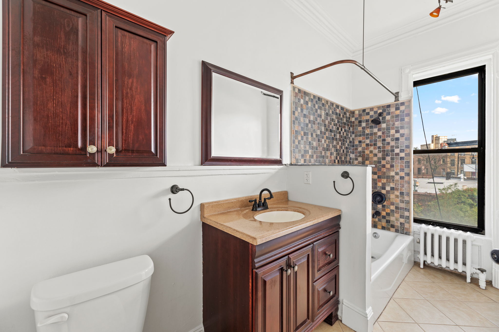 149 Sterling Place, Unit 3 Brooklyn, NY 11217 - Photo 6 of 9 a bathroom with a sink and a mirror
