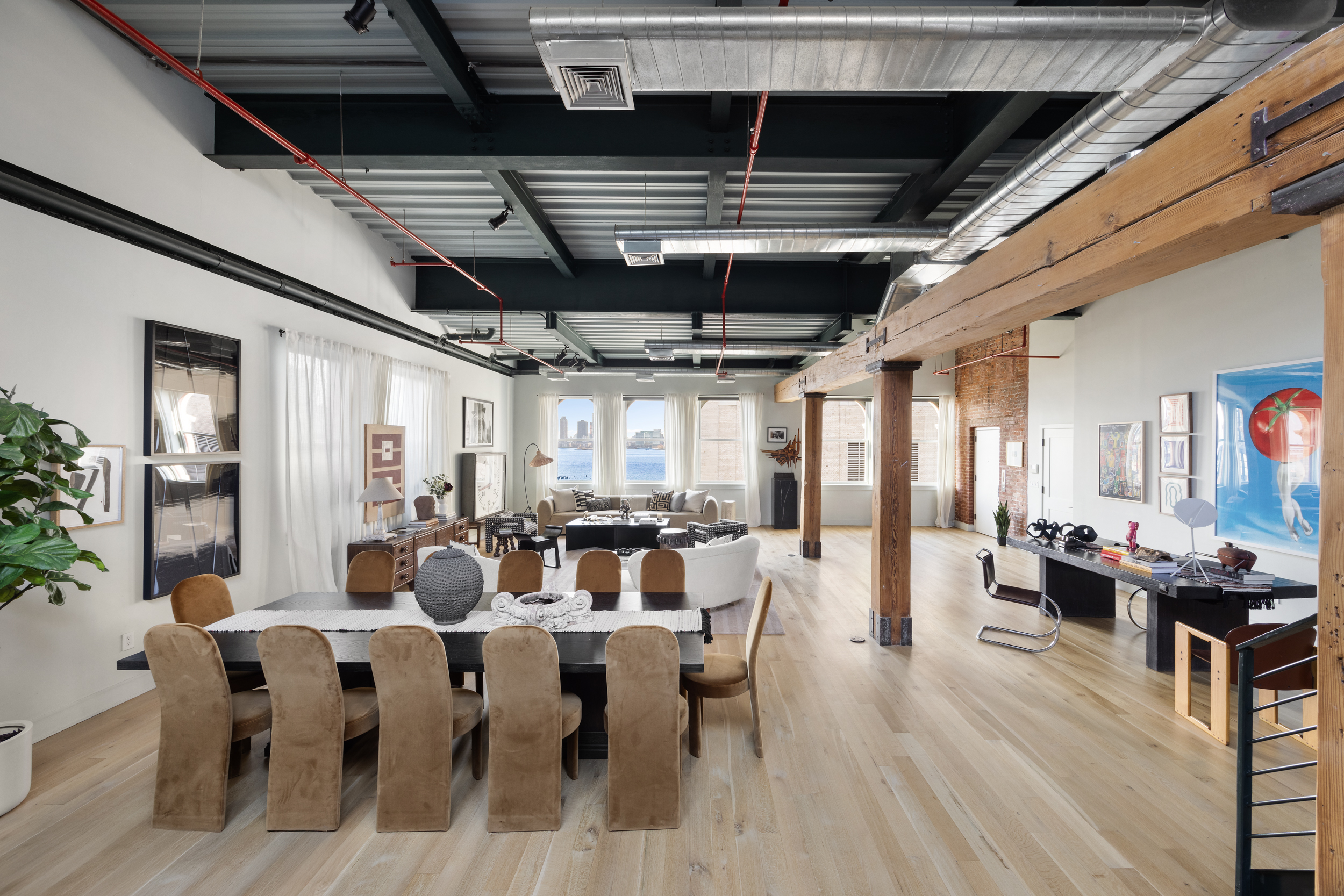481 Washington Street, Unit PHS Manhattan, NY 10013 - Photo 3 of 20 a view of a dining room with furniture window and wooden floor