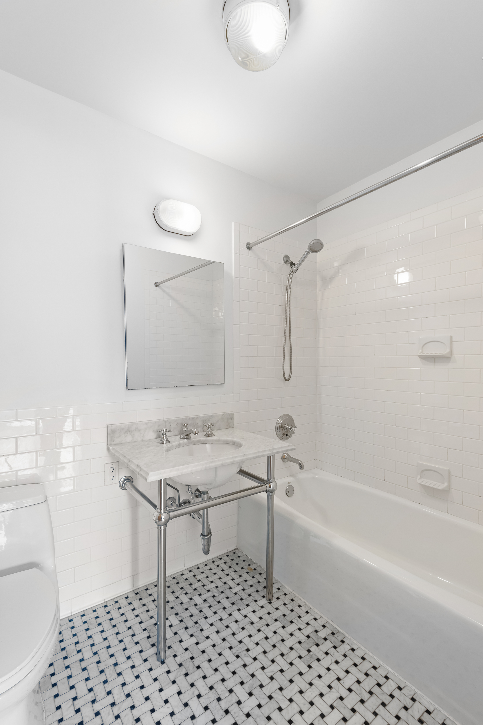 30 Main Street, Unit 10F Brooklyn, NY 11201 - Photo 9 of 16 a bathroom with a sink a toilet and shower