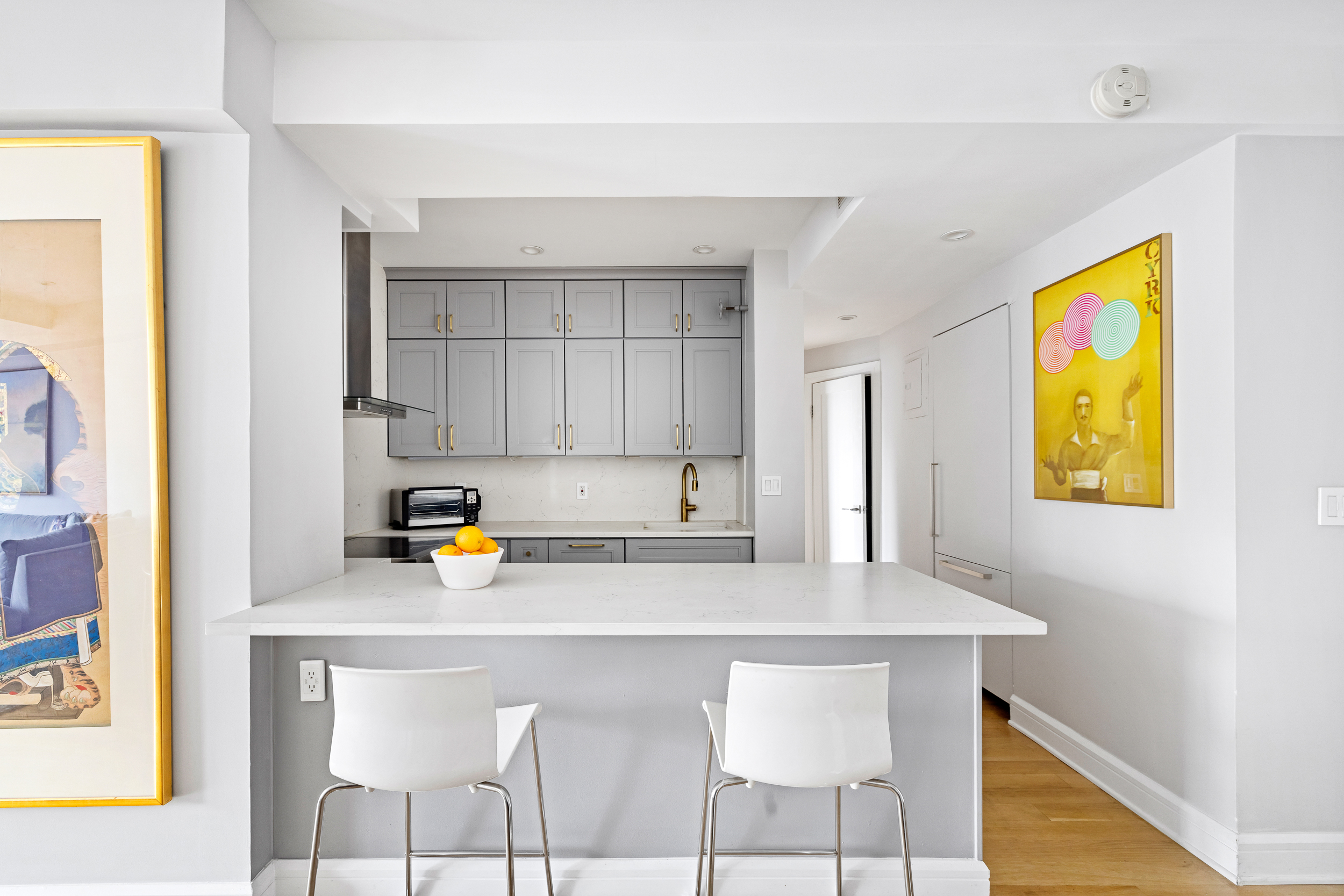 80 East End Avenue, Unit 17C Manhattan, NY 10028 - Photo 6 of 11 a kitchen with a sink cabinets and window