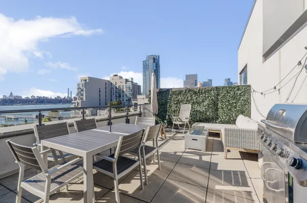 a view of a terrace with furniture and stove