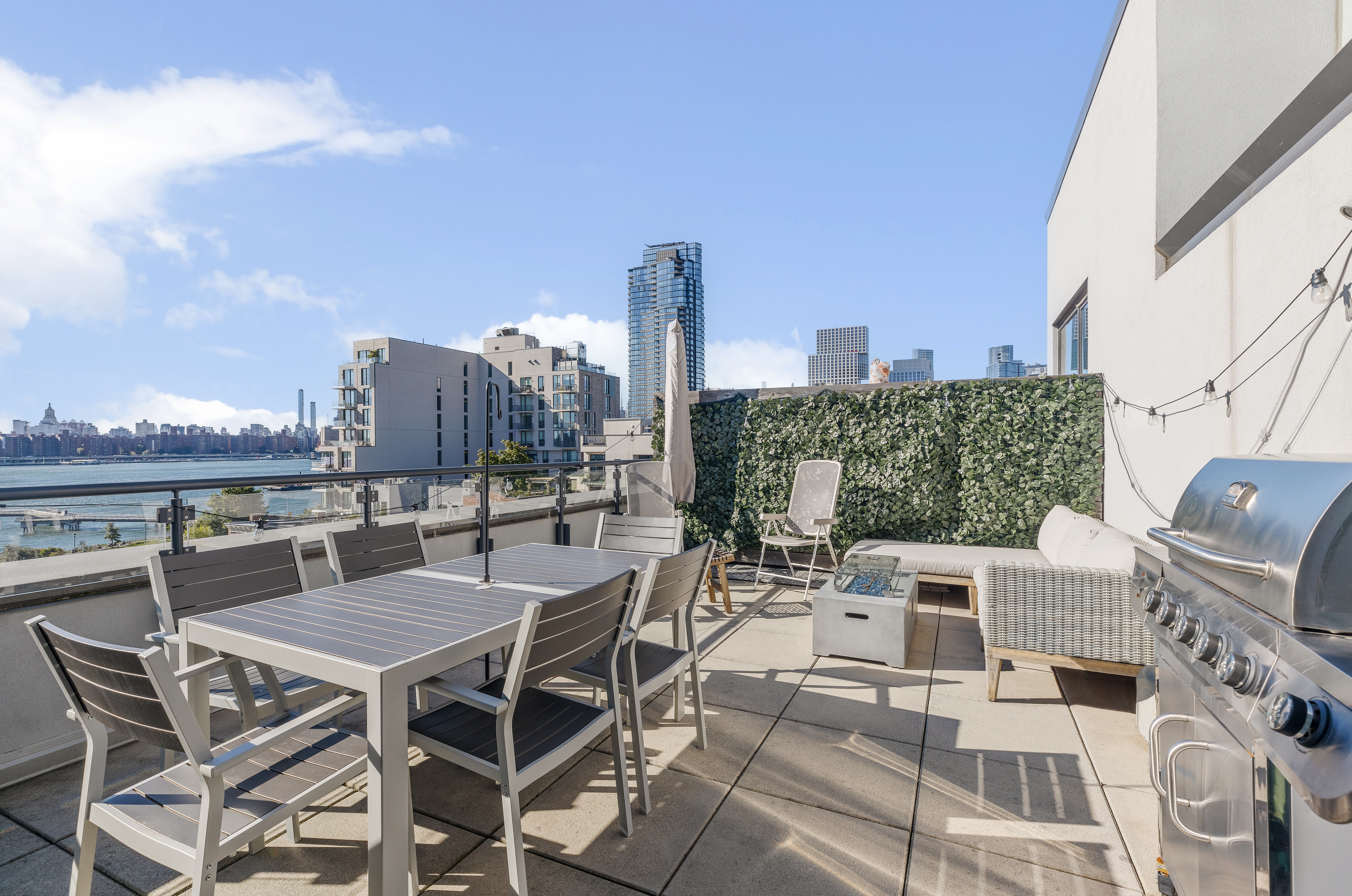 50 Greenpoint Avenue, Unit PHB Brooklyn, NY 11222 - Photo 2 of 13 a view of a terrace with furniture and stove