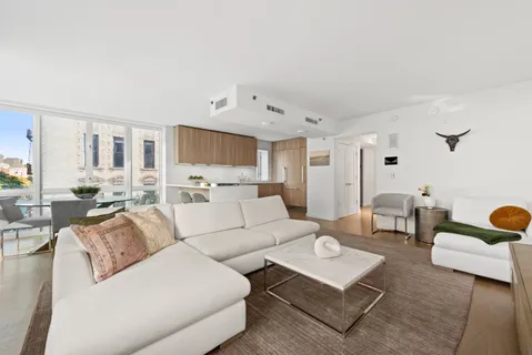 a living room with furniture and a table