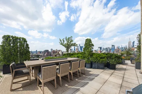 a patio with table and chairs