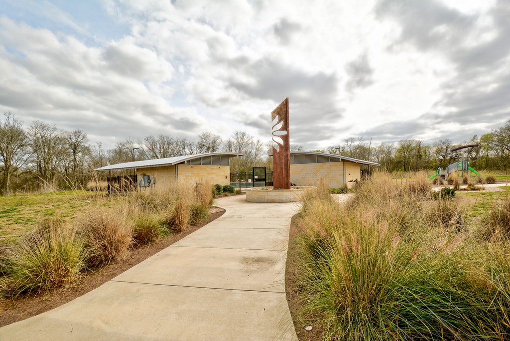 5400 Daimler Drive Austin, TX 78744 - Photo 25 of 27 a view of a lake with large trees