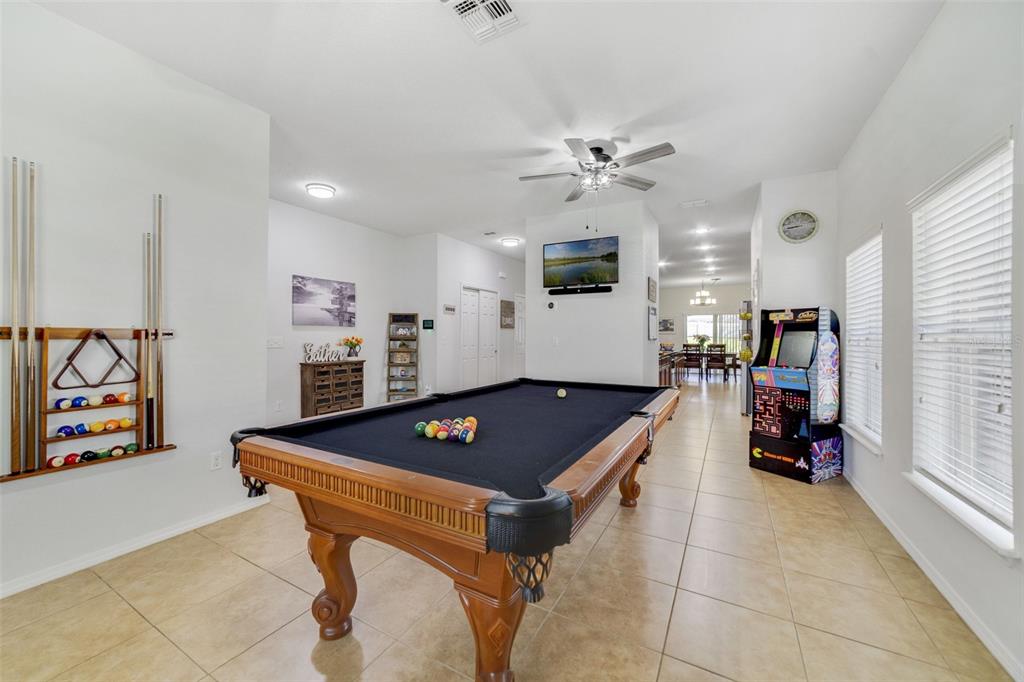 352 Giovani Boulevard Clermont, FL 34715 - Photo 6 of 46 a living room with furniture and a flat screen tv