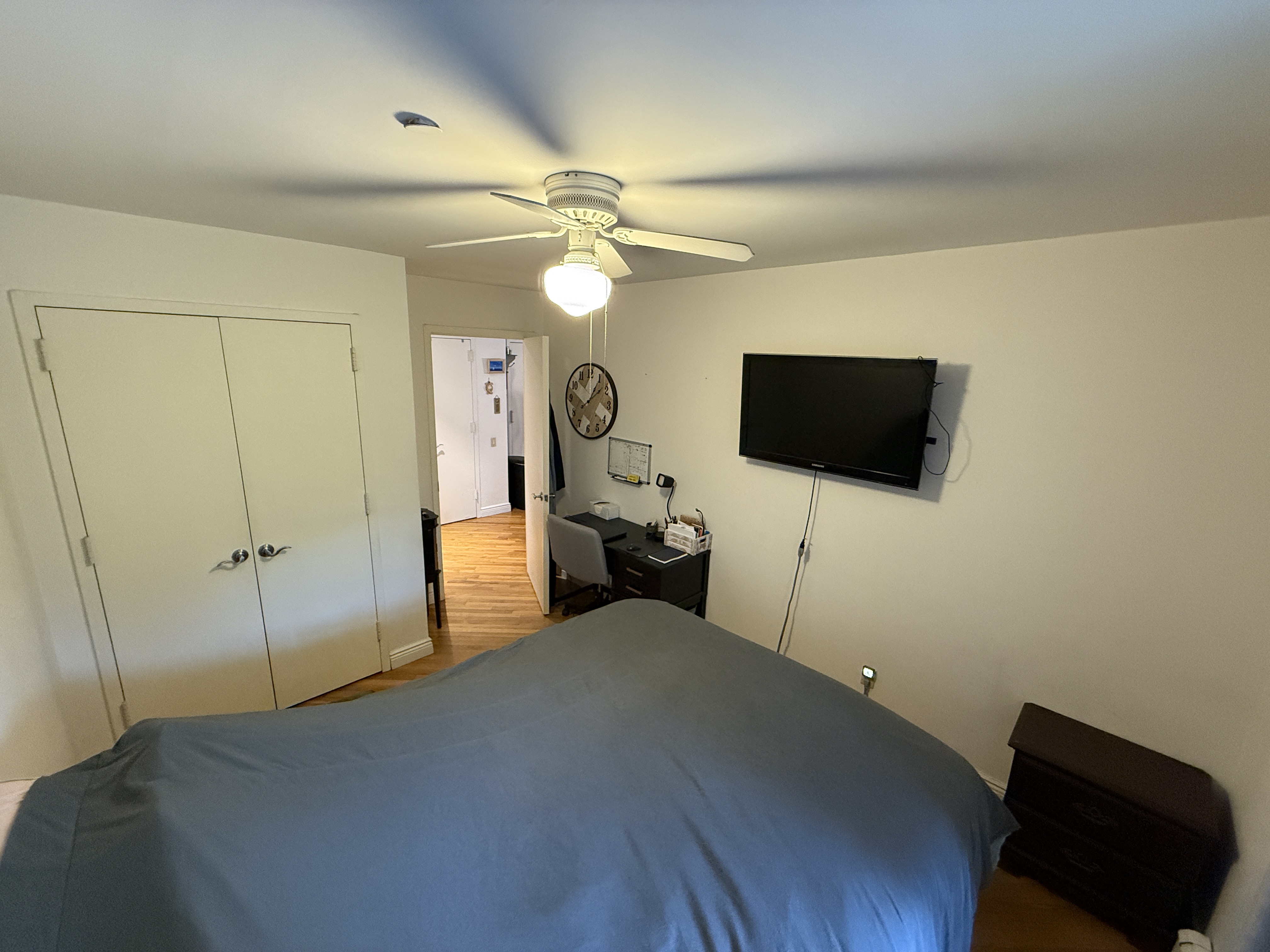 101 Prospect Park Southwest, Unit 3B Brooklyn, NY 11218 - Photo 14 of 23 a bedroom with a bed and a flat screen tv