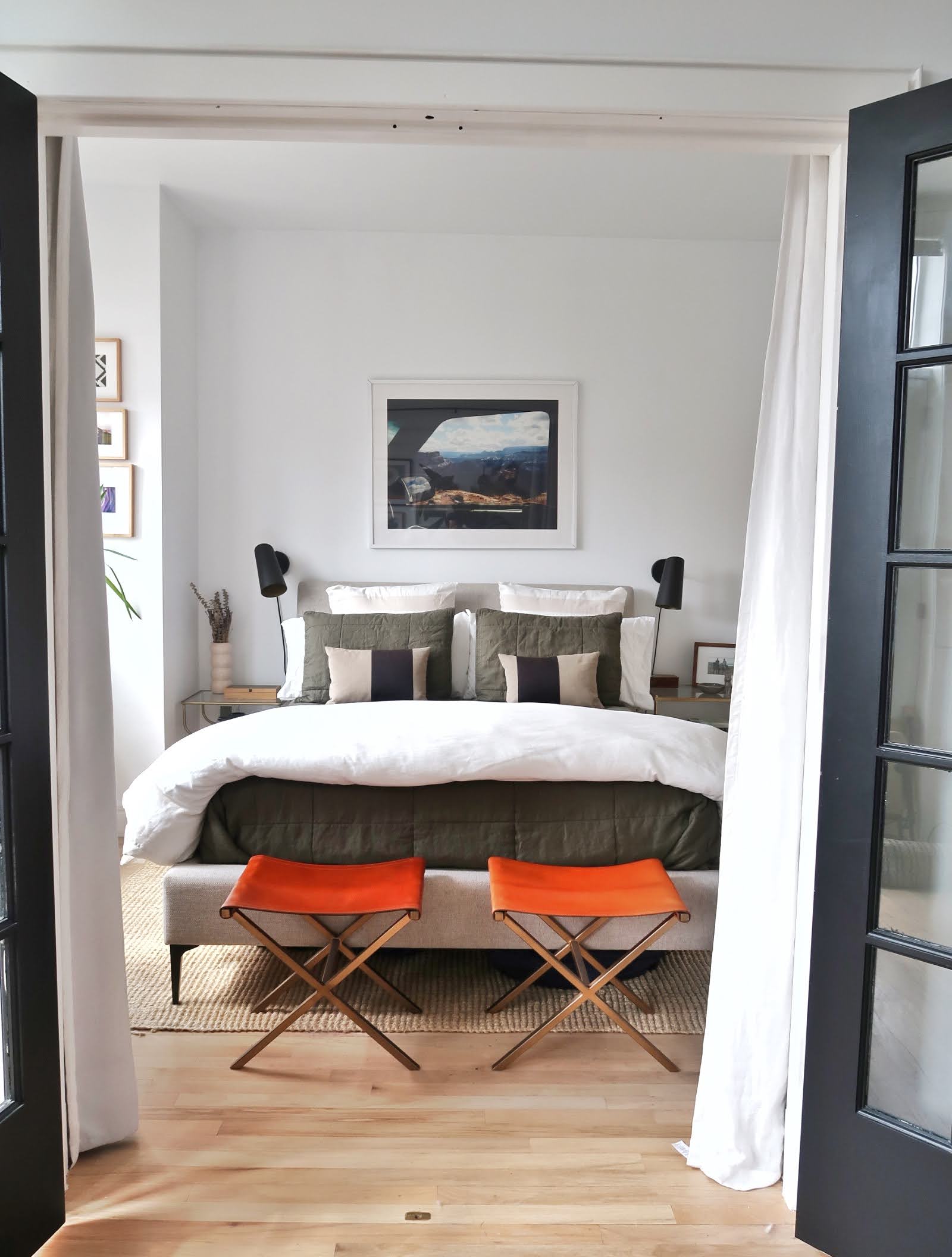 296 East 2nd Street, Unit 4G Manhattan, NY 10009 - Photo 12 of 14 a bedroom with a bed and a mirror