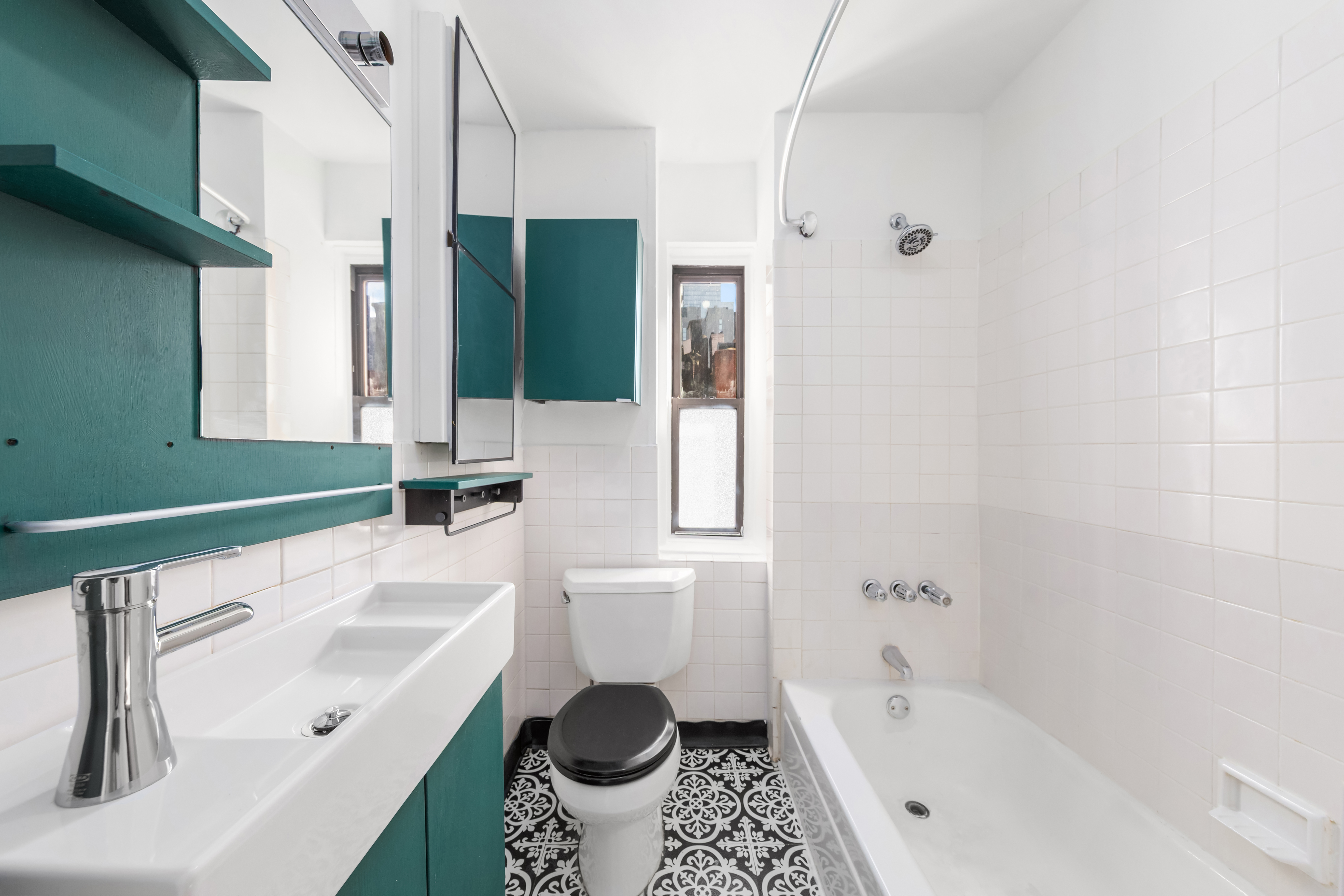 406 West 47th Street, Unit 2D Manhattan, NY 10036 - Photo 4 of 7 a bathroom with a sink a toilet and bathtub