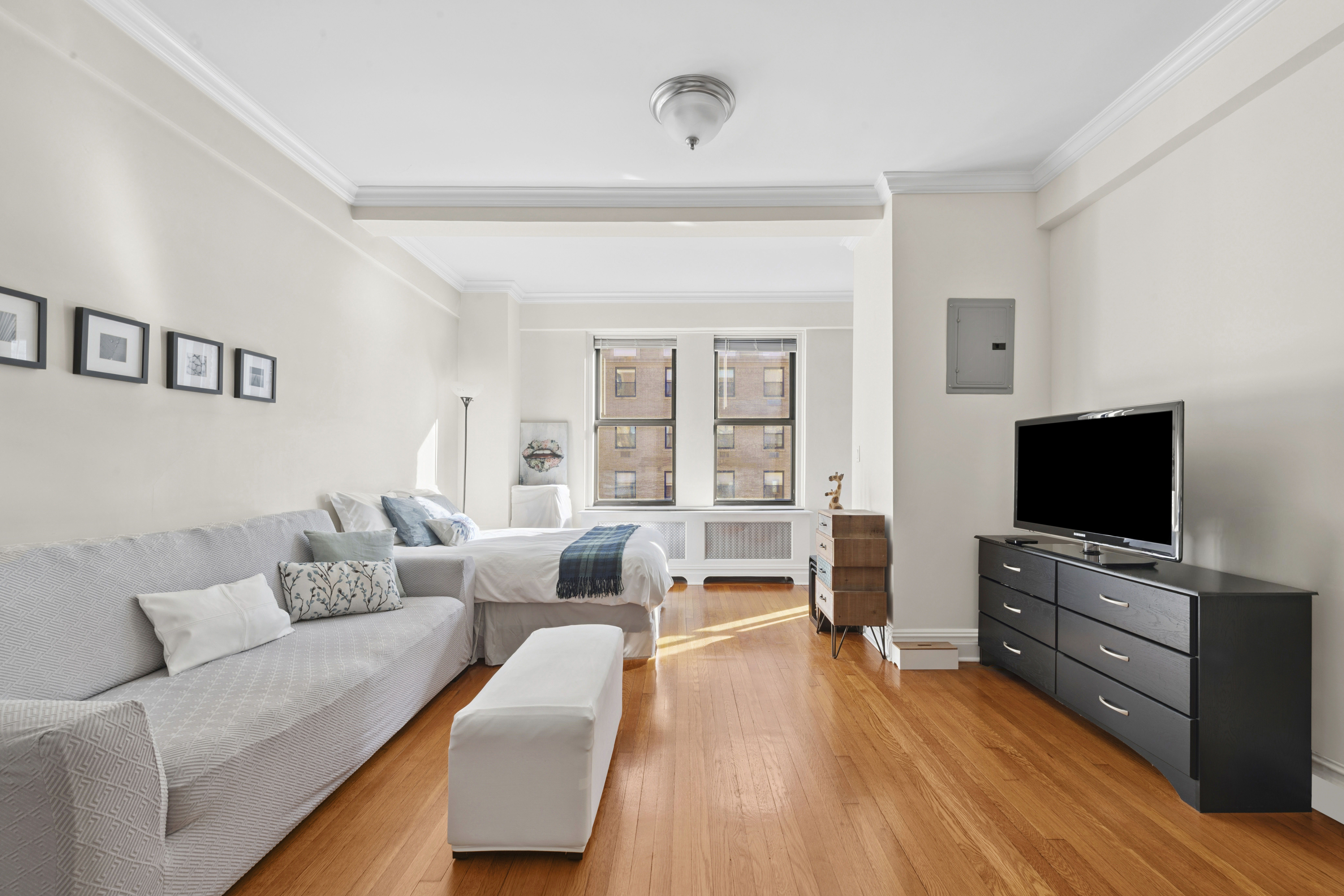 a living room with furniture and a flat screen tv