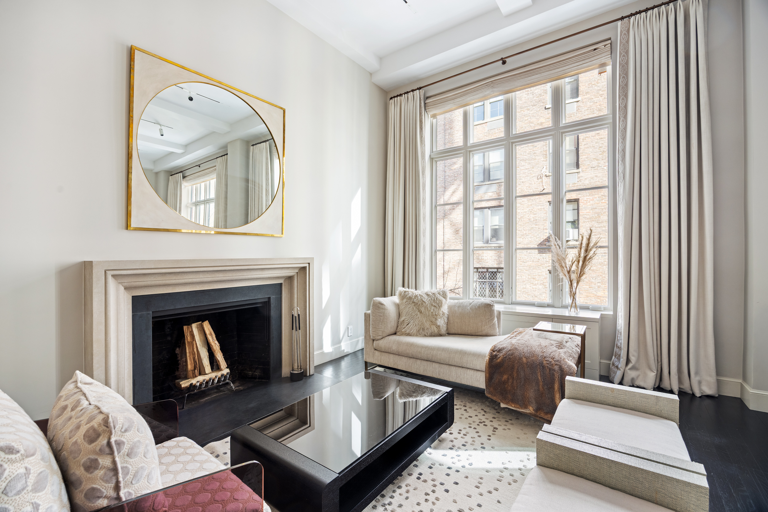 169 East 78th Street, Unit 7C Manhattan, NY 10075 - Photo 3 of 30 a living room with furniture and a fireplace