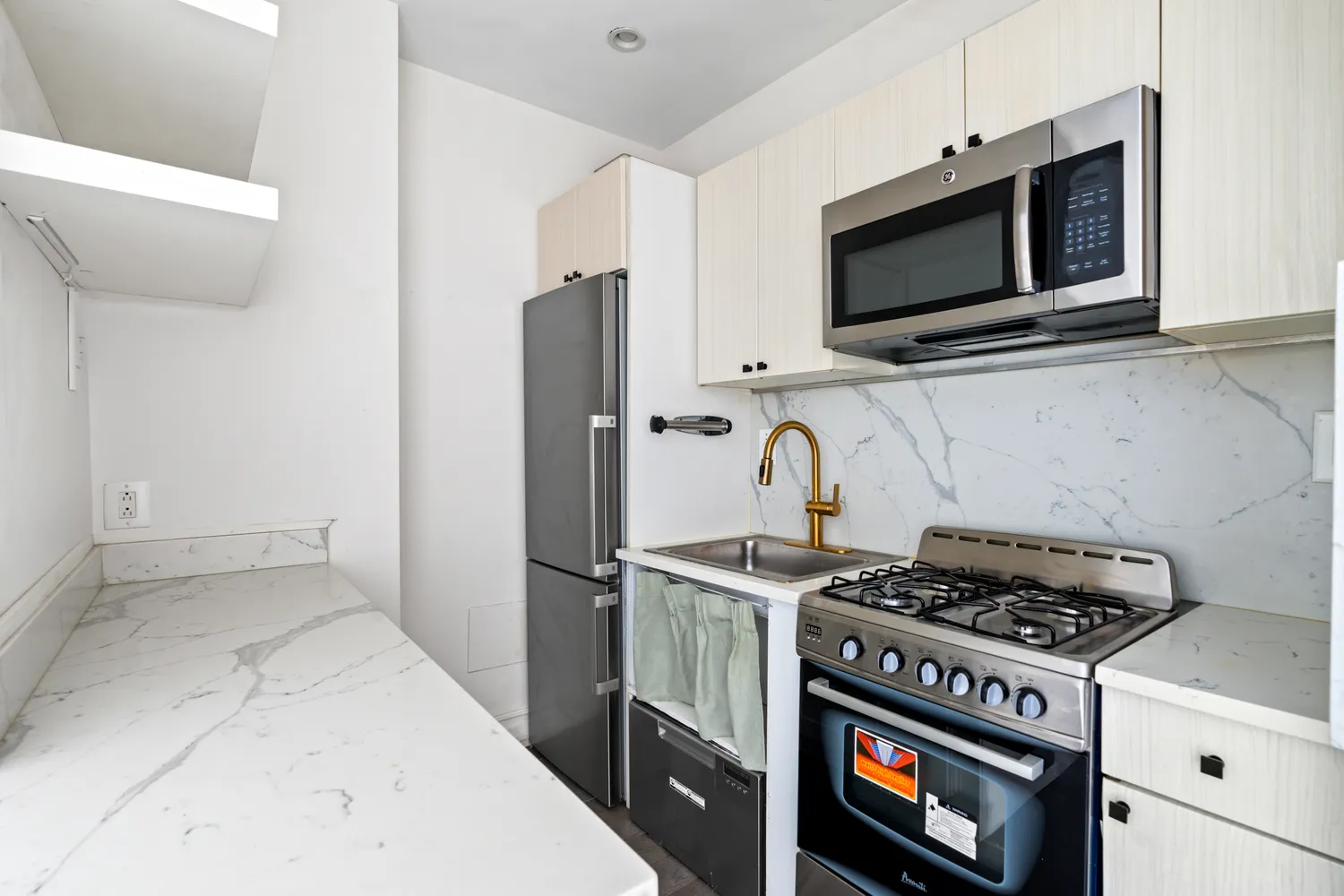 a kitchen with a stove and a microwave