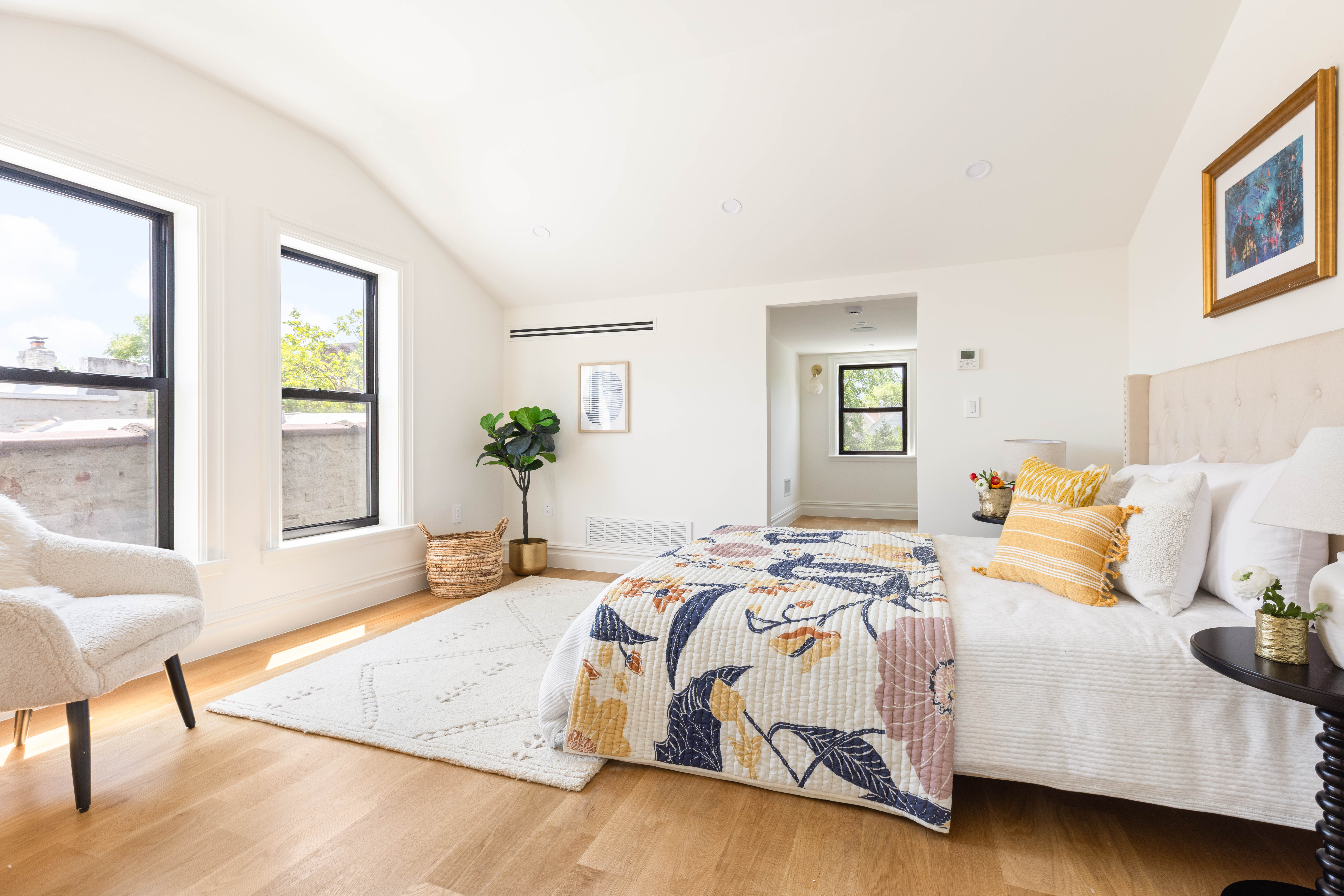 287 Midwood Street Brooklyn, NY 11225 - Photo 10 of 17 a bedroom with a bed and wooden floor