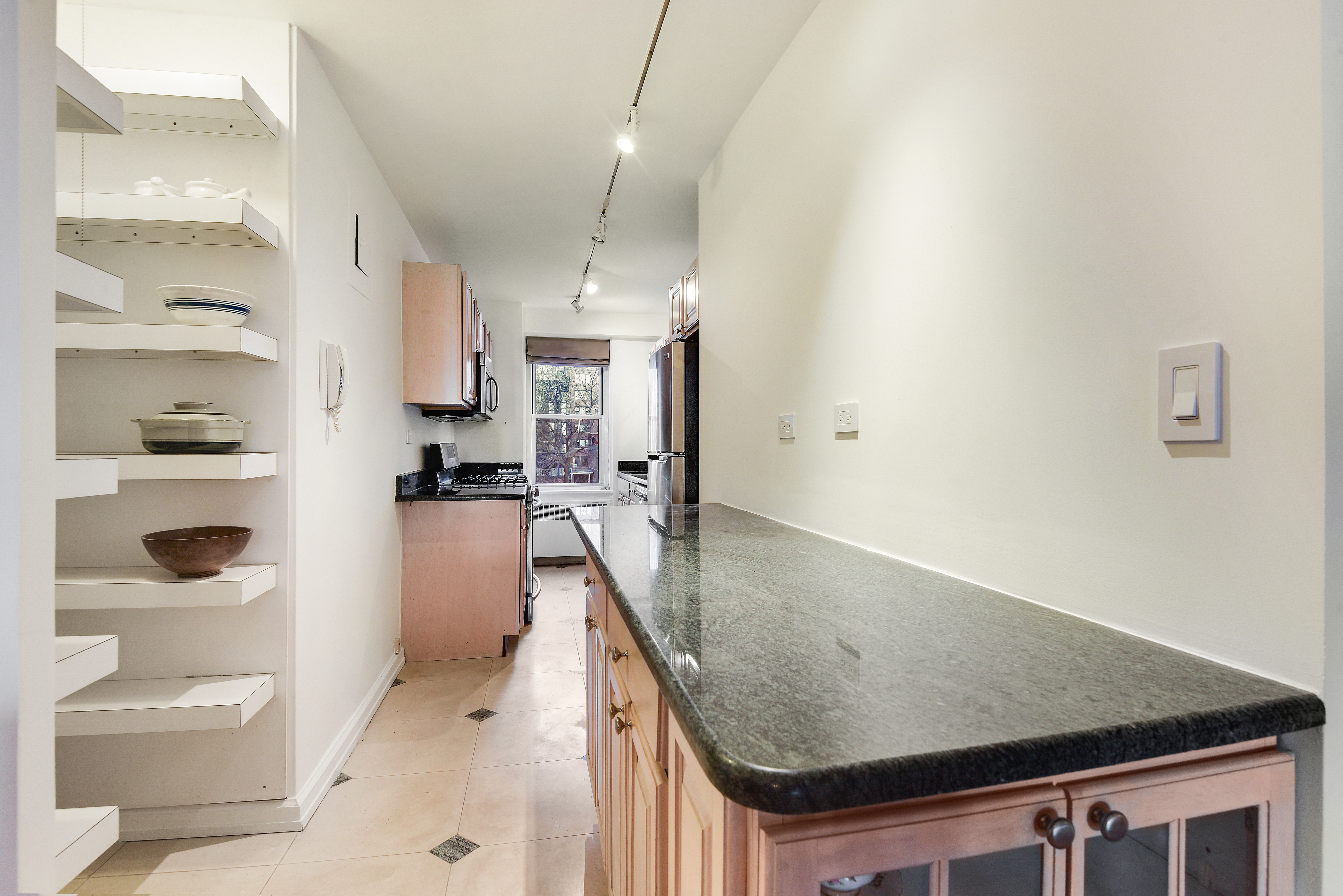 150 East 61st Street, Unit 5C Manhattan, NY 10065 - Photo 6 of 18 a view of a kitchen with appliances and cabinets