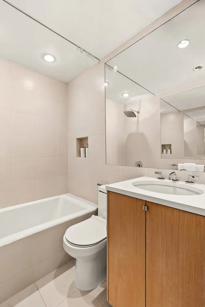 a bathroom with a sink a toilet and a bathtub