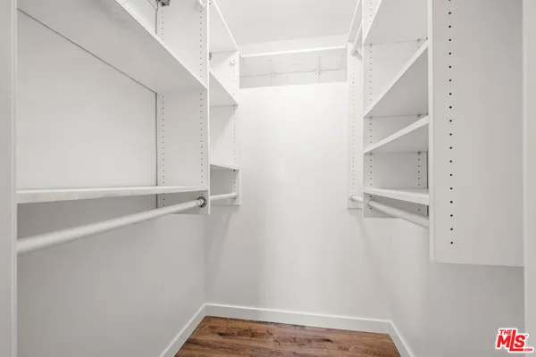 a view of an empty walk in closet