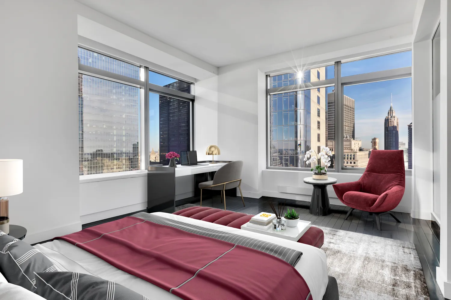 a bedroom with a bed and large windows