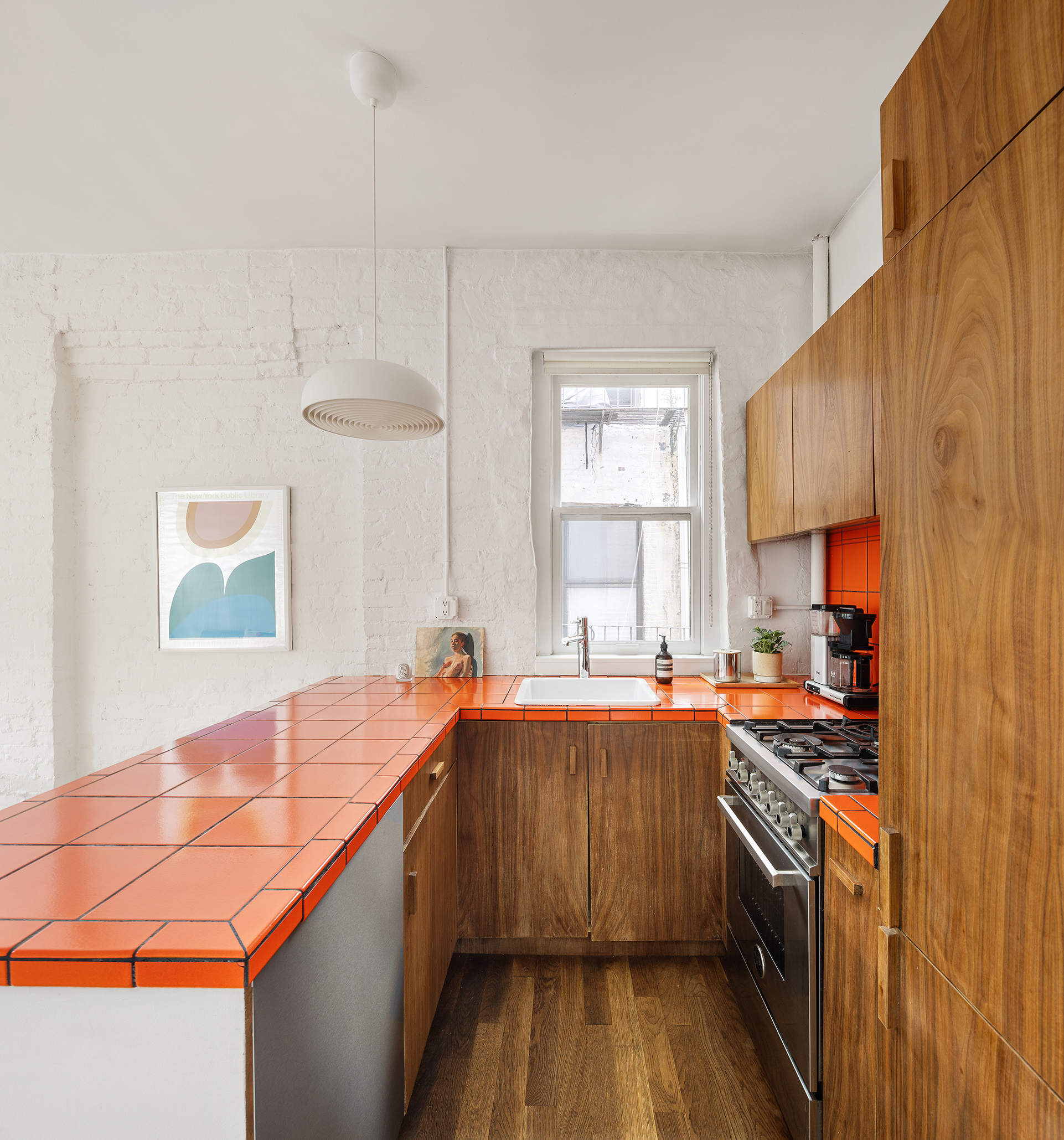 305 East 4th Street, Unit 2 Manhattan, NY 10009 - Photo 3 of 11 a kitchen with stainless steel appliances granite countertop a sink and a stove