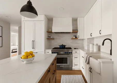 a kitchen with a sink cabinets and stainless steel appliances
