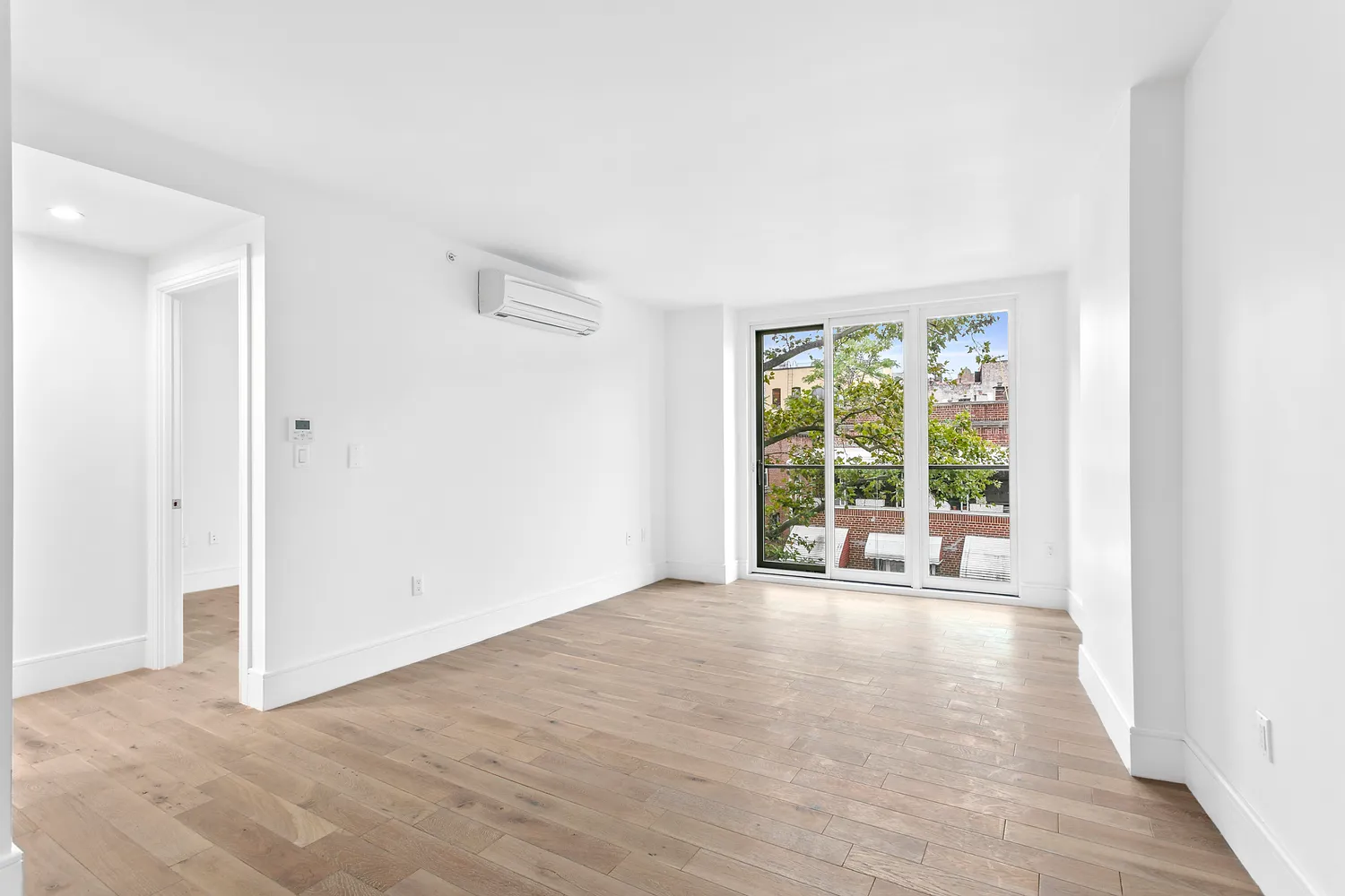 a view of an empty room with a window