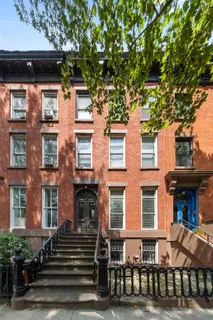 a front view of a building with a lot of windows