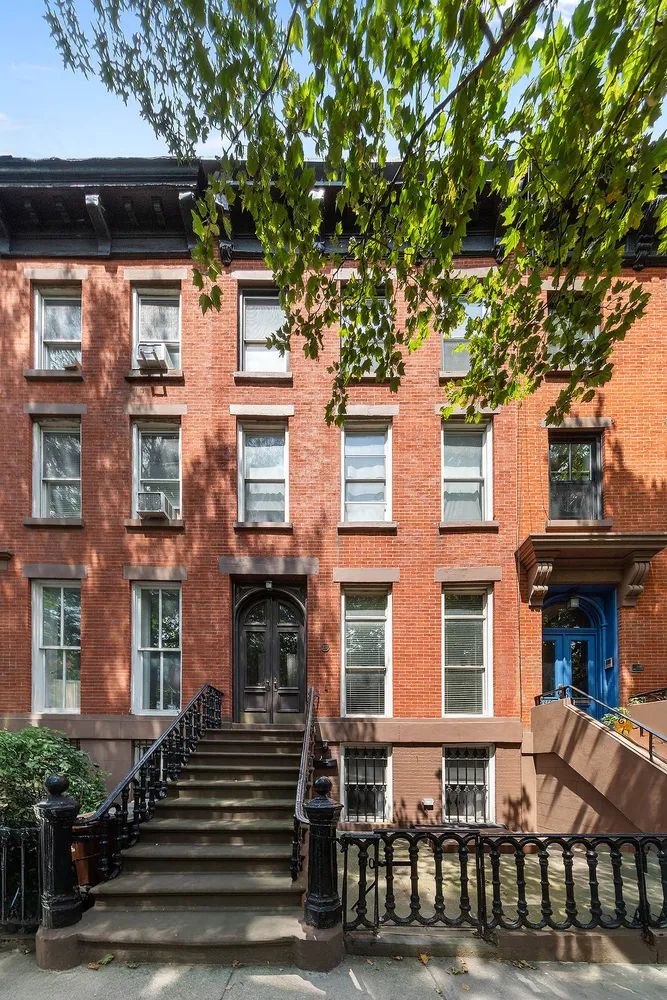 a front view of a building with a lot of windows